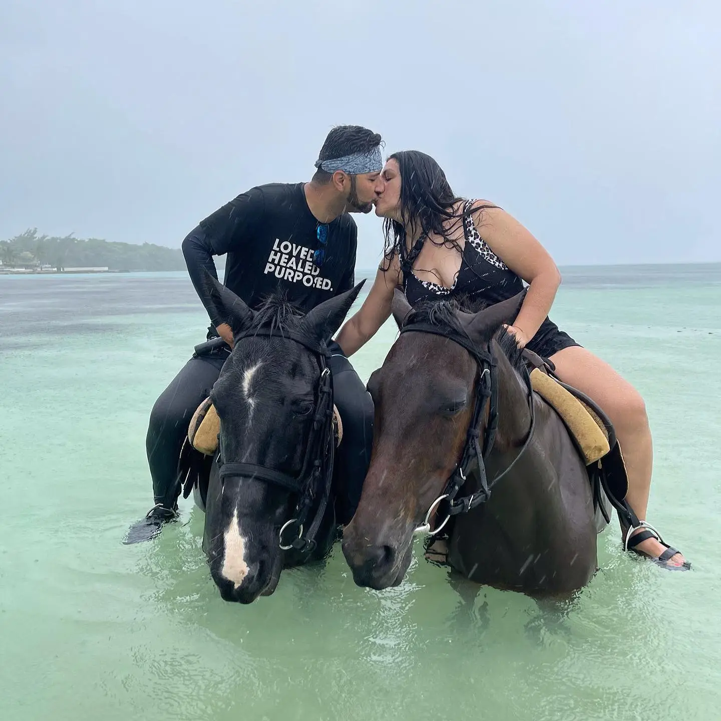Guests on a horseback tour in the ocean with Inside Tours Jamaica