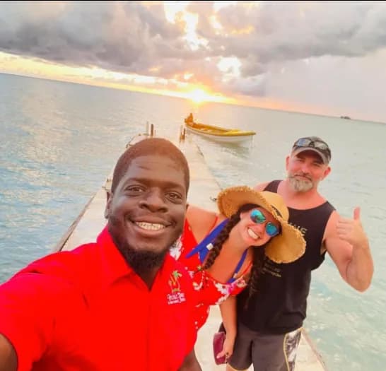 Guests and their guide on a dock at sunset during an Inside Tours Jamaica excursion